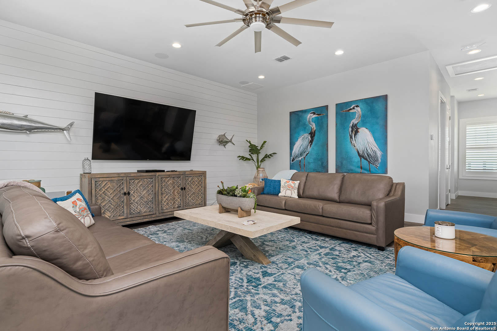 107 Windjammer Road Rockport, TX 78382 - Photo 10 of 52 a living room with furniture and a flat screen tv