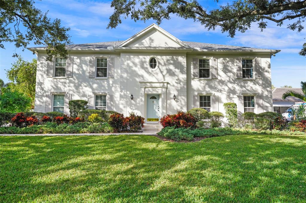 4913 Andros Drive Tampa, FL 33629 - Photo 1 of 57 a front view of a house with a garden