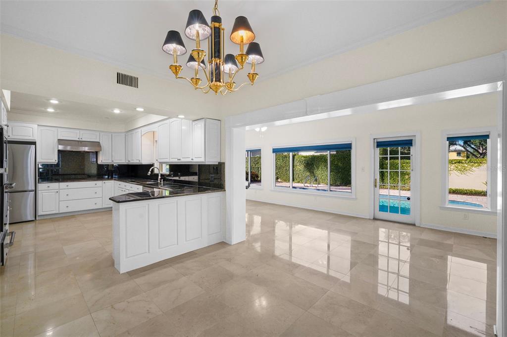 4913 Andros Drive Tampa, FL 33629 - Photo 15 of 57 a large kitchen with a window and stainless steel appliances