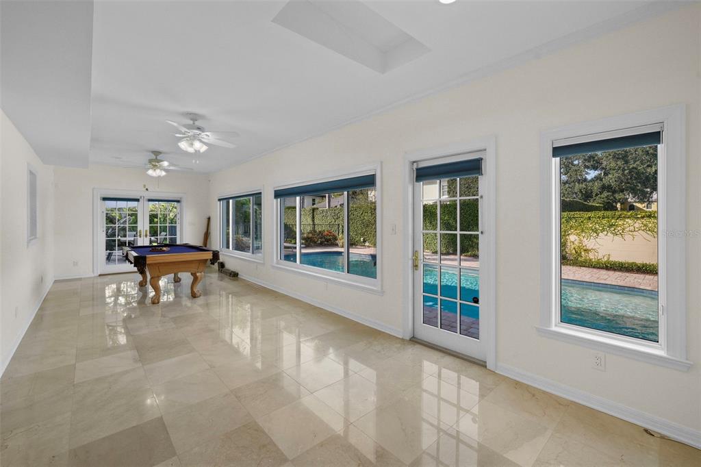 4913 Andros Drive Tampa, FL 33629 - Photo 16 of 57 a living room with furniture and a large window