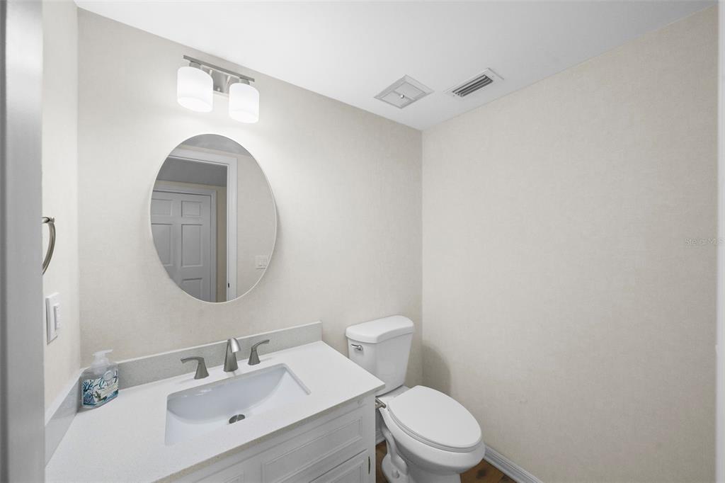 4913 Andros Drive Tampa, FL 33629 - Photo 19 of 57 a bathroom with a toilet sink and mirror