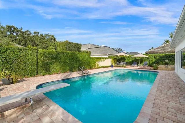 a view of a swimming pool with a lake view