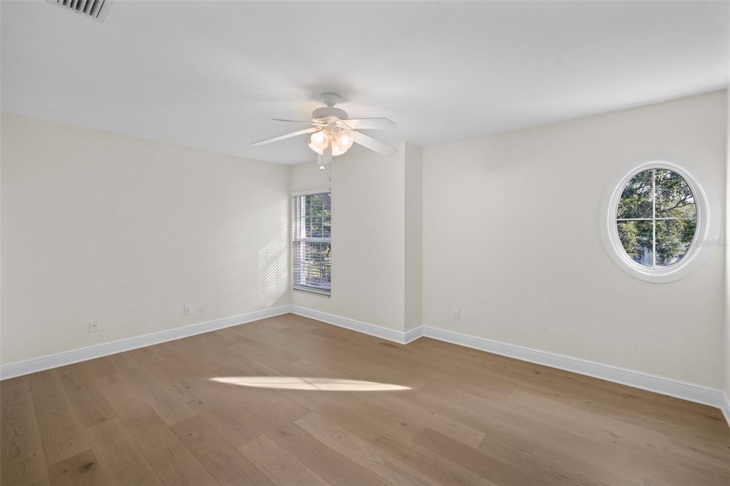 4913 Andros Drive Tampa, FL 33629 - Photo 38 of 57 an empty room with windows and fan