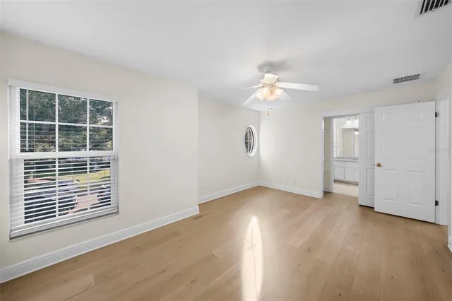 a bathroom with a sink a toilet and shower curtain