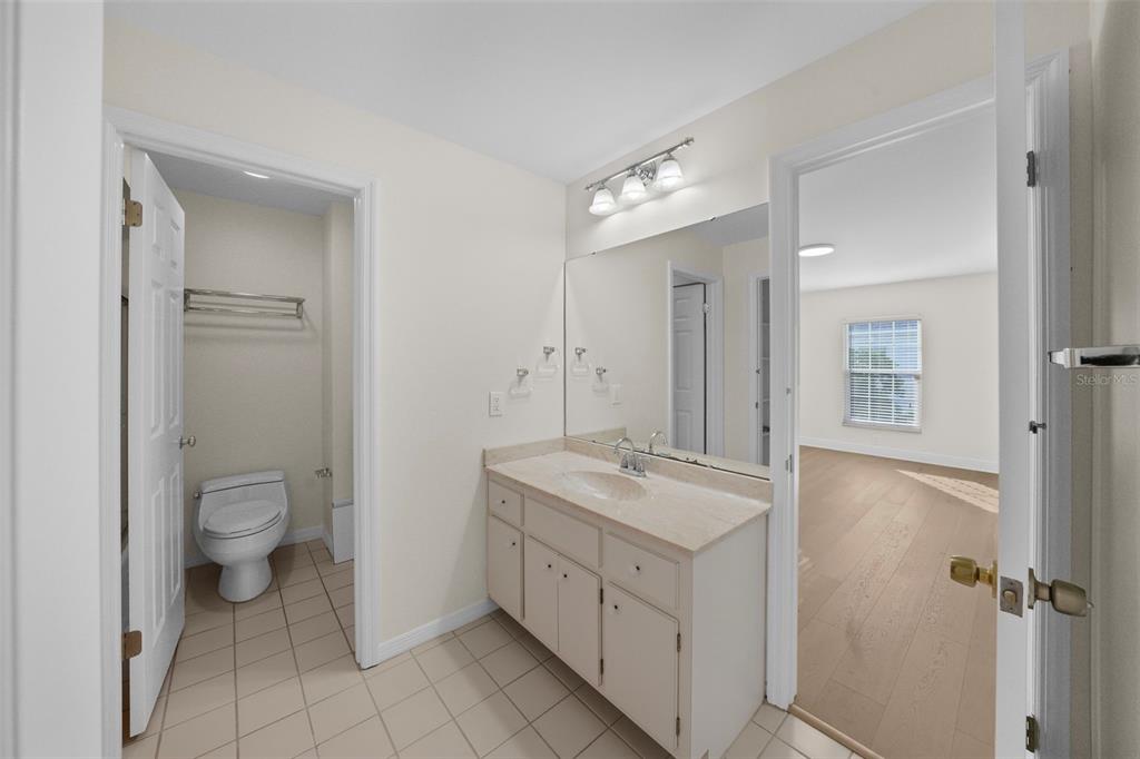 4913 Andros Drive Tampa, FL 33629 - Photo 40 of 57 a spacious bathroom with a granite countertop sink a toilet and a mirror