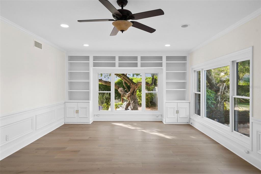 4913 Andros Drive Tampa, FL 33629 - Photo 4 of 57 a view of an empty room with a window and a ceiling fan