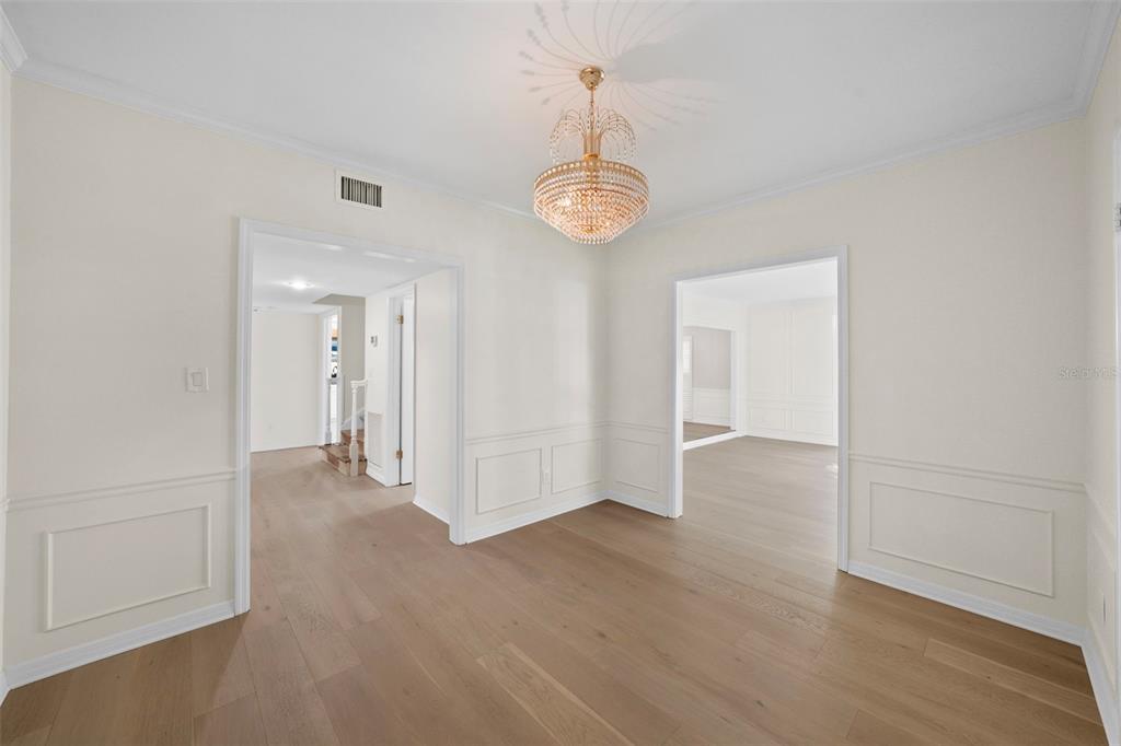 4913 Andros Drive Tampa, FL 33629 - Photo 6 of 57 a view of a hallway with wooden floor