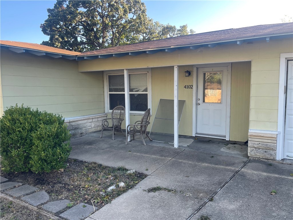 4102 Aspen Street Bryan, TX 77801 - Photo 1 of 19 a front view of a house with garden
