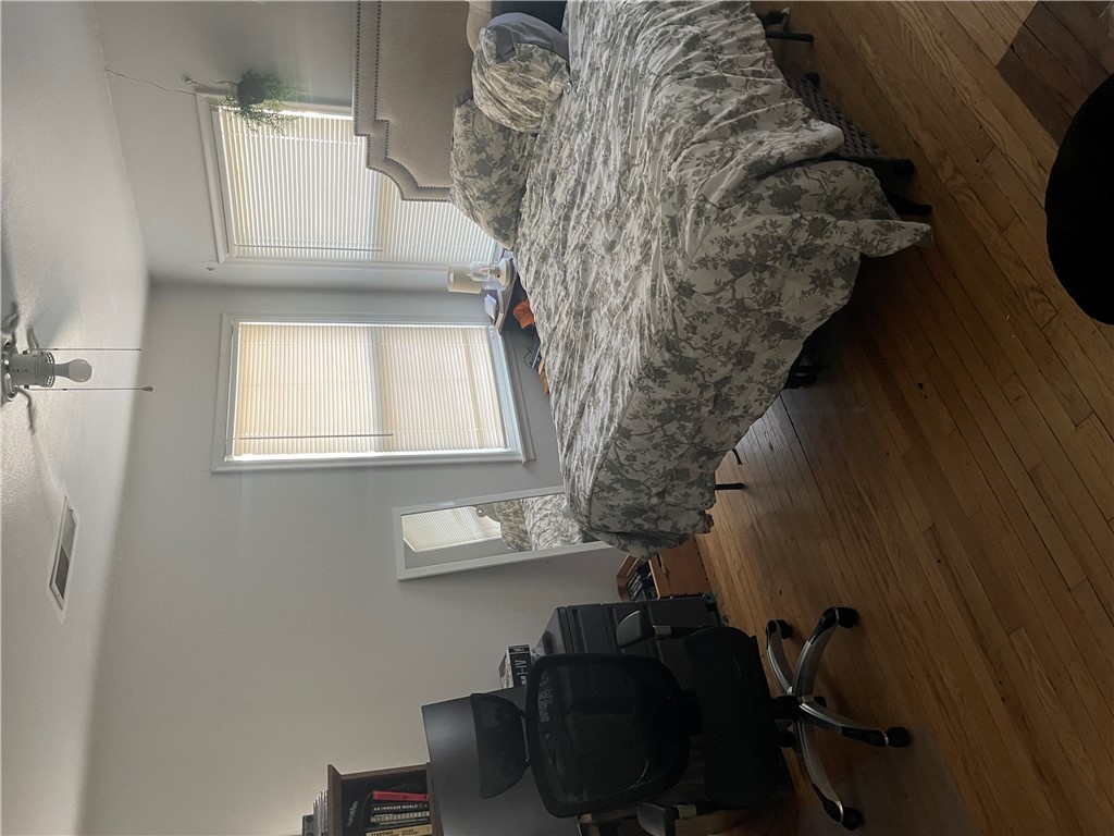 4102 Aspen Street Bryan, TX 77801 - Photo 17 of 19 a bedroom with a bed chair and a window