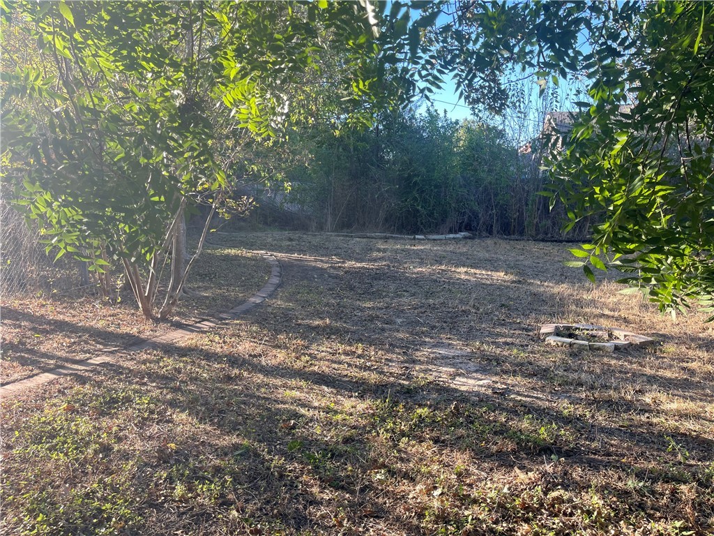 4102 Aspen Street Bryan, TX 77801 - Photo 2 of 19 a view of a yard with large trees