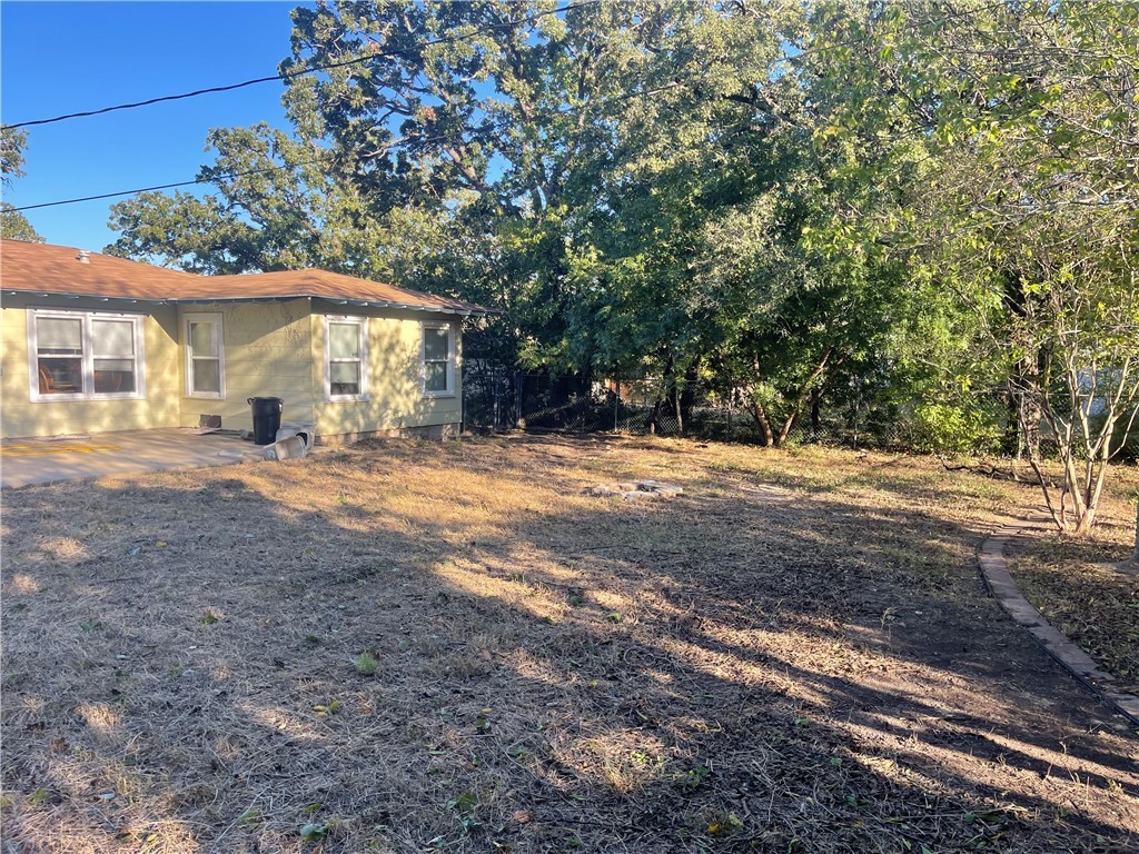 4102 Aspen Street Bryan, TX 77801 - Photo 5 of 19 a view of a yard with a house and large tree