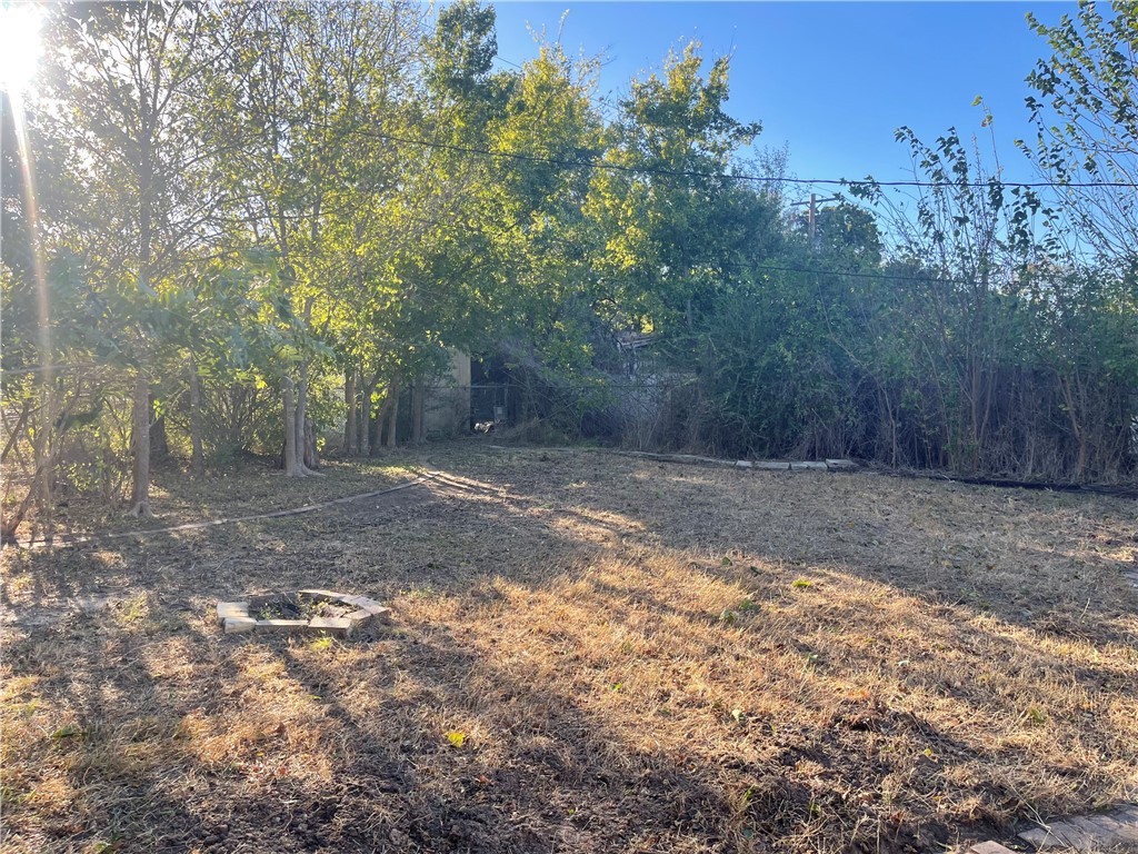 4102 Aspen Street Bryan, TX 77801 - Photo 6 of 19 a view of a backyard with large trees