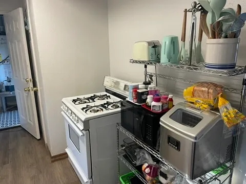 a kitchen with a stove and a sink