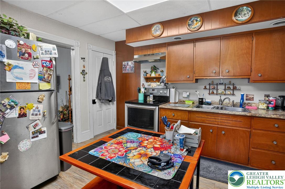 357 Main Road Lehighton, PA 18235 - Photo 11 of 38 a kitchen with stainless steel appliances granite countertop a refrigerator and sink