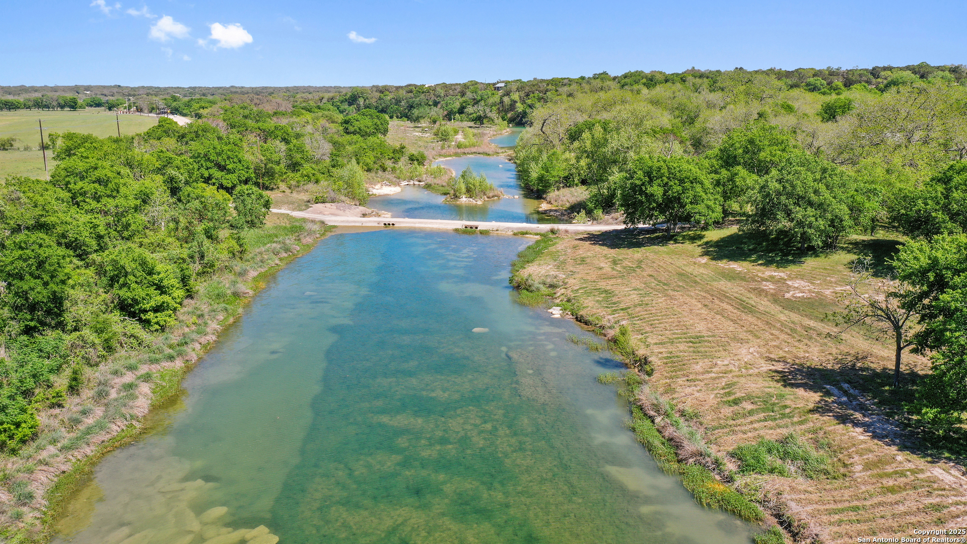 Tbd Lost Acres Loop Blanco, TX 78606 - Photo 27 of 39 a view of a lake with a yard