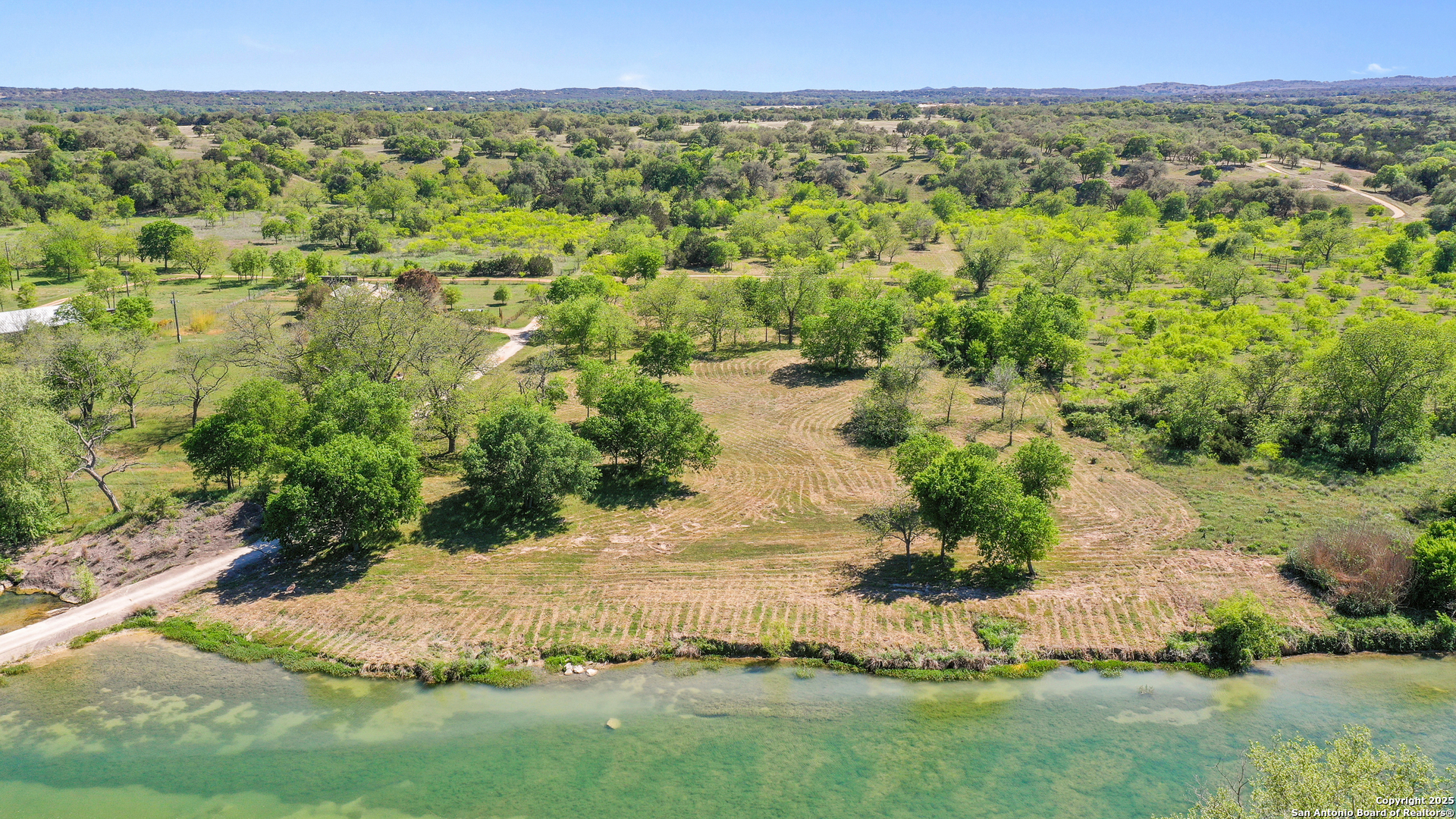 Tbd Lost Acres Loop Blanco, TX 78606 - Photo 36 of 39 a view of a lake with a yard