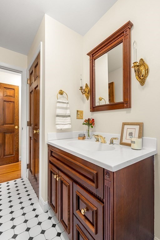 6 Cameron Road Andover, MA 01810 - Photo 22 of 42 a bathroom with a sink a vanity and a mirror