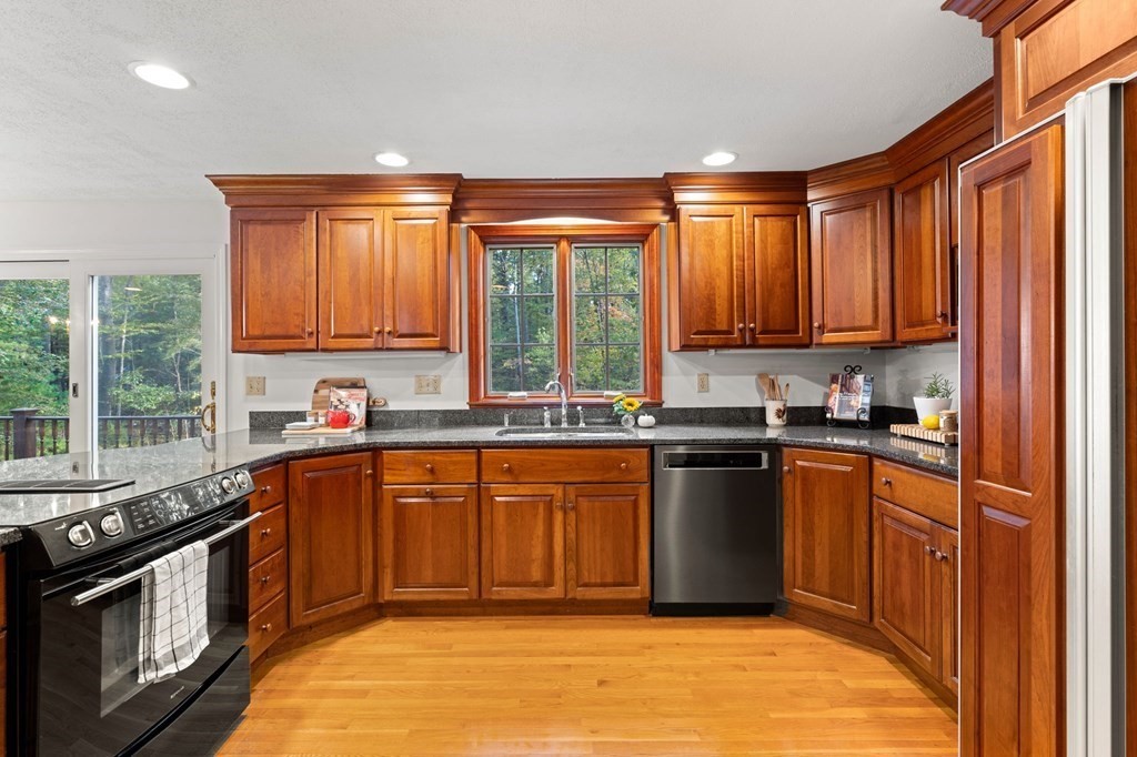 6 Cameron Road Andover, MA 01810 - Photo 3 of 42 a kitchen with stainless steel appliances granite countertop a stove a sink dishwasher and a refrigerator