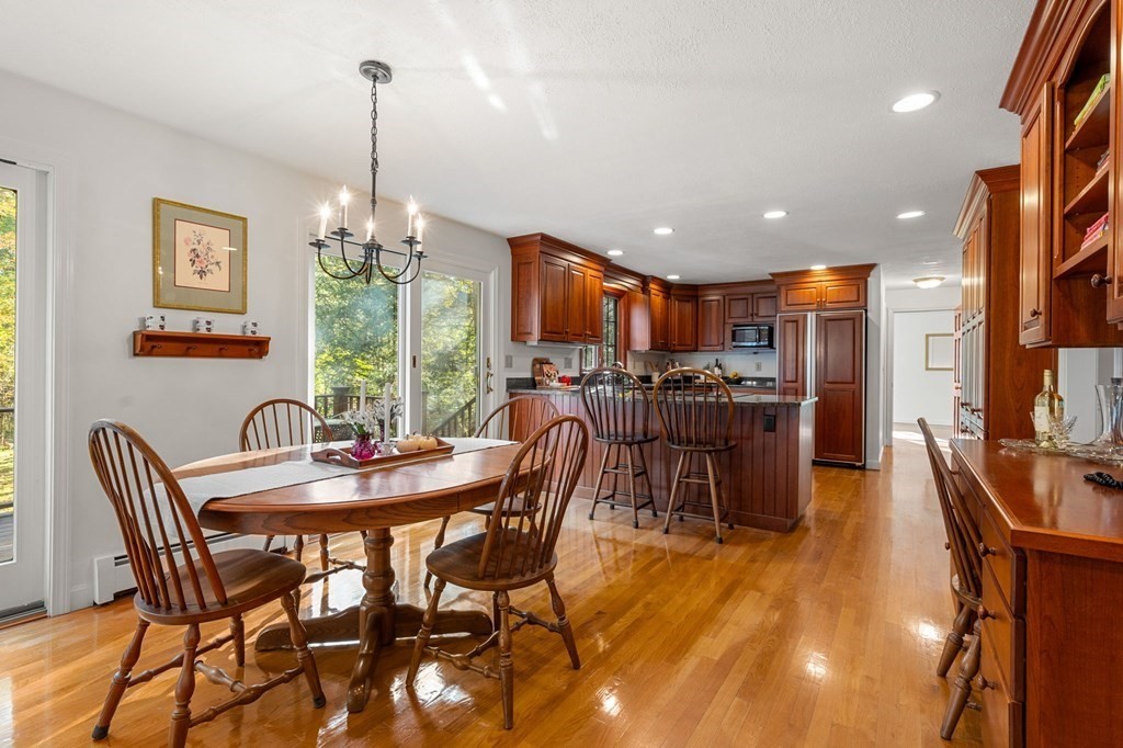 6 Cameron Road Andover, MA 01810 - Photo 5 of 42 a view of a dining room with furniture a chandelier and wooden floor