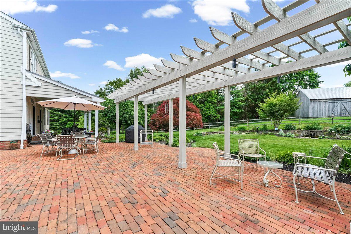7 Bolingbroke Road West Chester, PA 19382 - Photo 64 of 86 Charming patio with lush greenery.