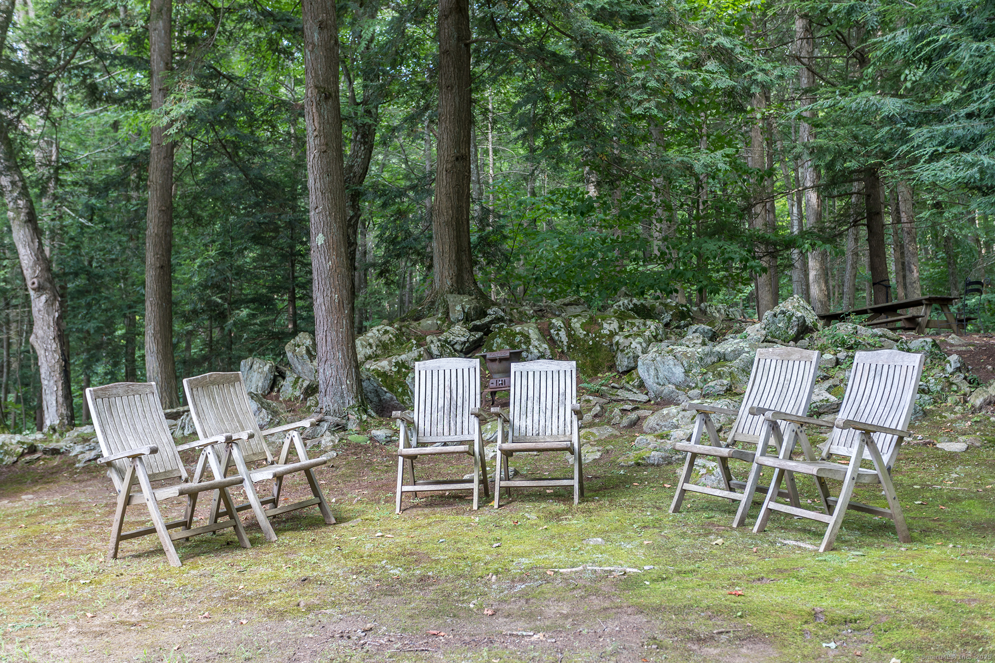 60 Leach Hollow Road Sherman, CT 06784 - Photo 3 of 24 a view of a wooden chairs and backyard