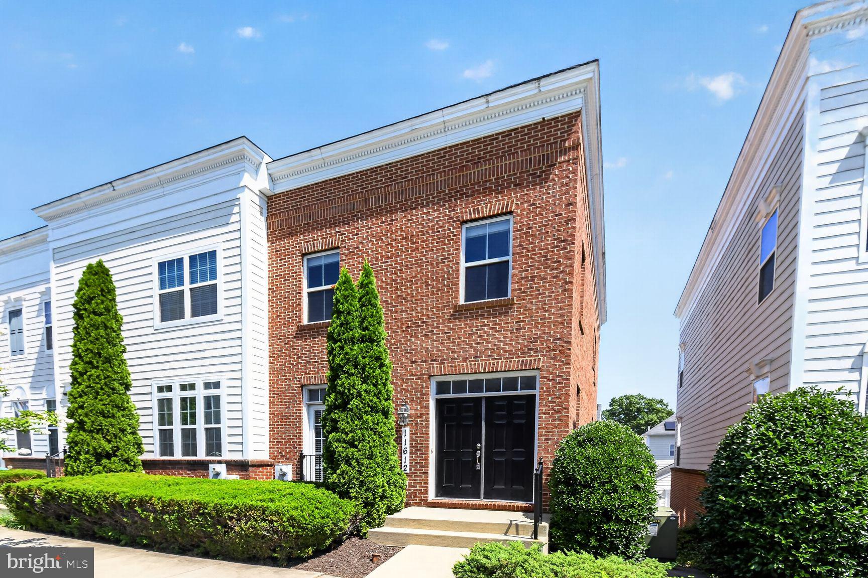 11612 Leesborough Circle Silver Spring, MD 20902 - Photo 1 of 29 Charming brick facade with lush greenery.