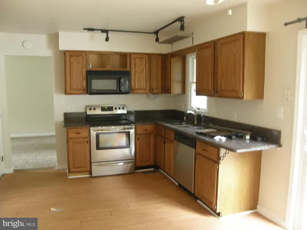 a kitchen with a stove and a microwave