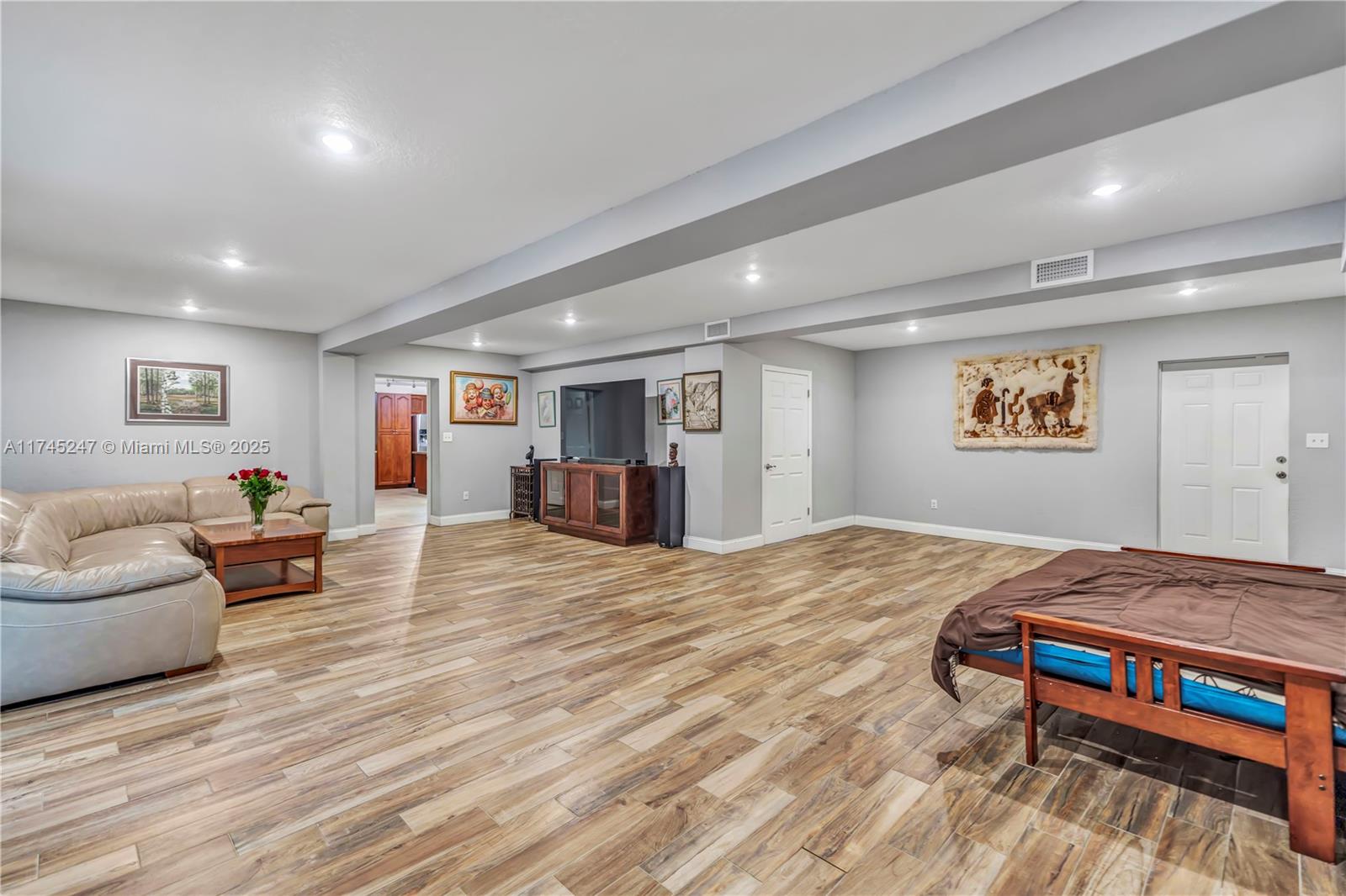 15101 Southwest 27th Street Davie, FL 33331 - Photo 19 of 100 a spacious bedroom with a bed and a couch