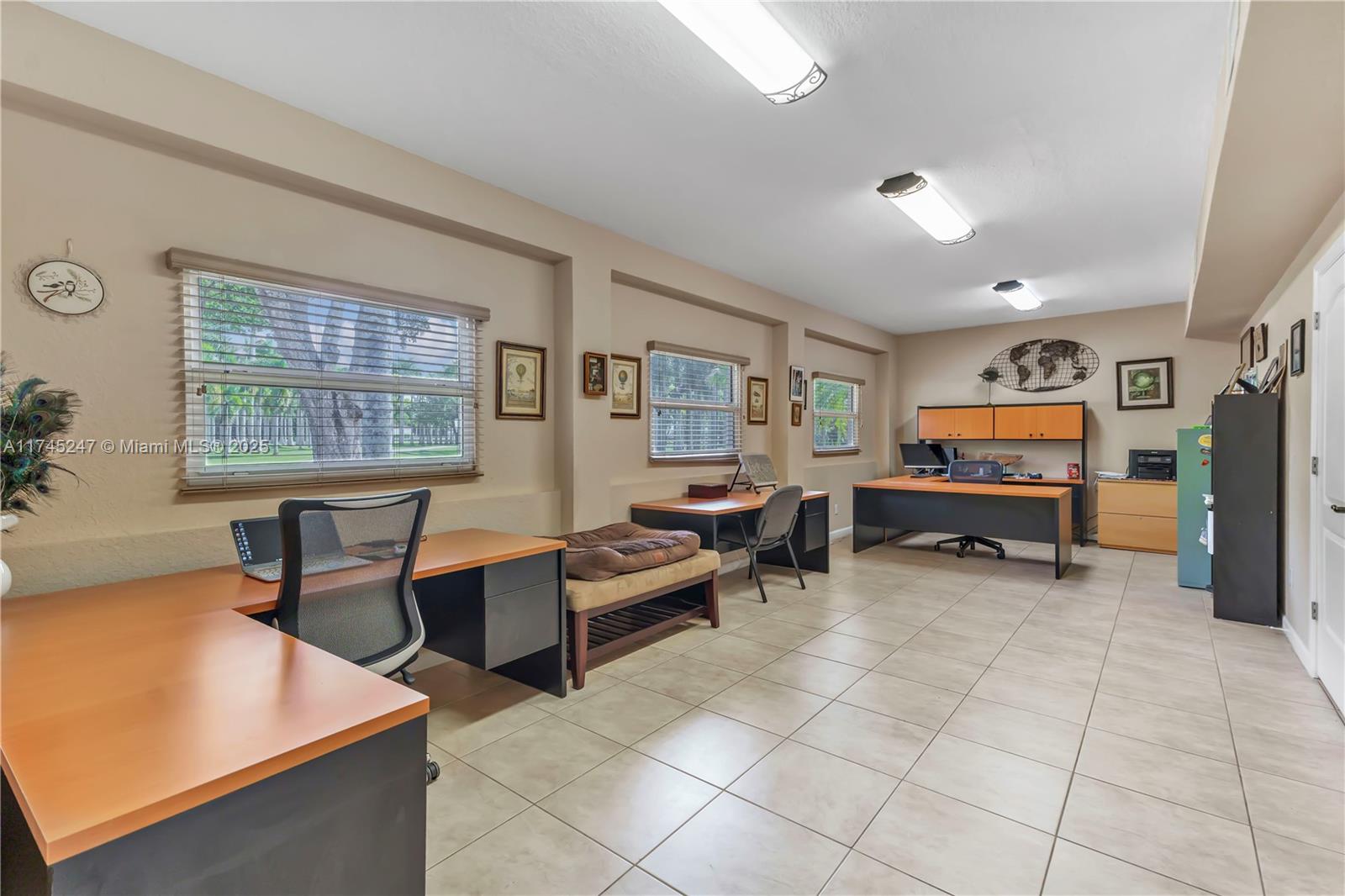 15101 Southwest 27th Street Davie, FL 33331 - Photo 24 of 100 a living room with furniture and a flat screen tv