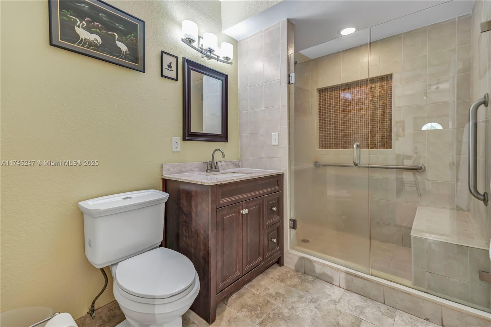 15101 Southwest 27th Street Davie, FL 33331 - Photo 32 of 100 a bathroom with a toilet sink and shower