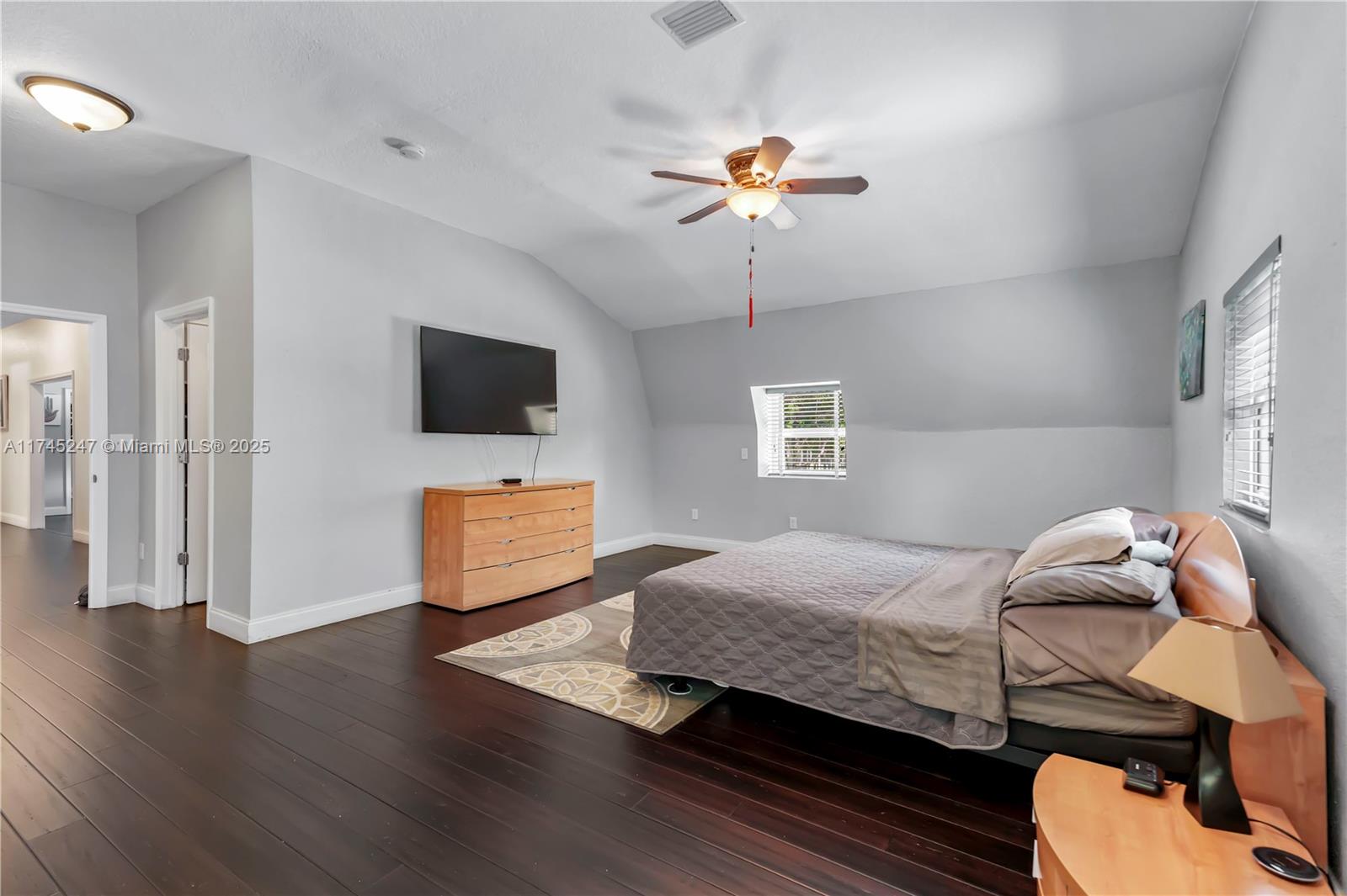 15101 Southwest 27th Street Davie, FL 33331 - Photo 37 of 100 a bedroom with a bed and a flat screen tv