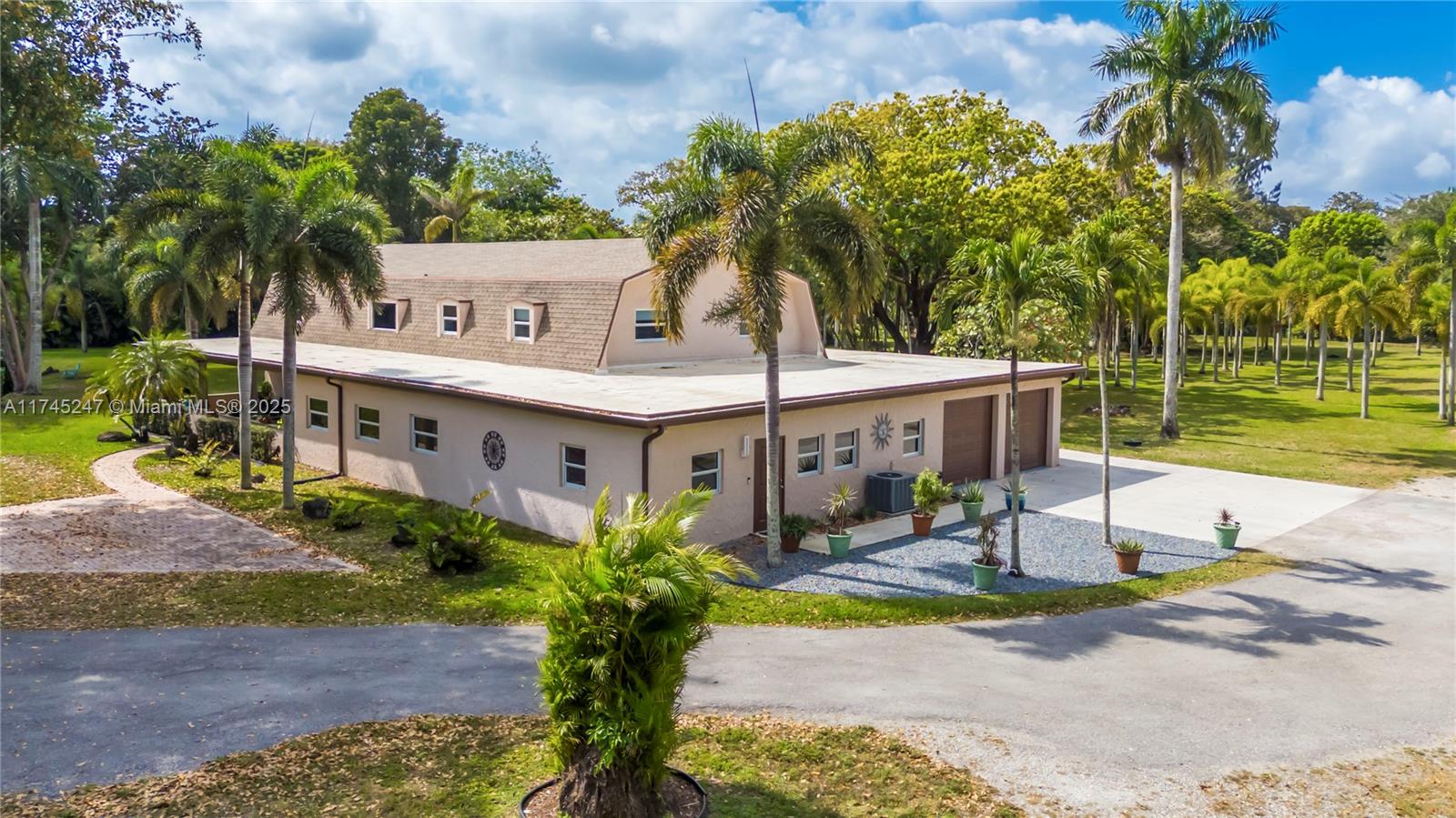 15101 Southwest 27th Street Davie, FL 33331 - Photo 4 of 100 a view of a house with garden and a patio