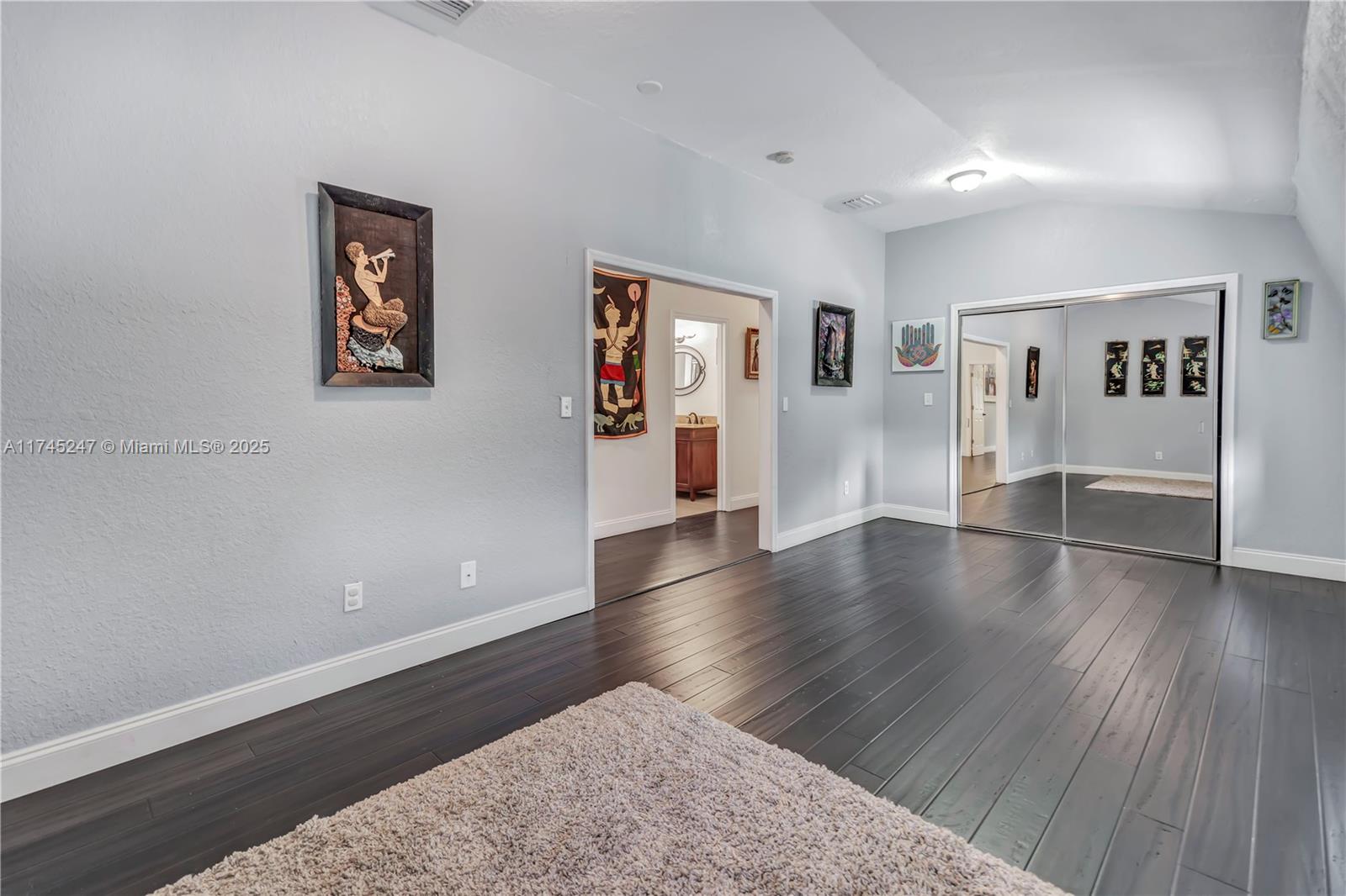 15101 Southwest 27th Street Davie, FL 33331 - Photo 42 of 100 a view of a big room with wooden floor and windows