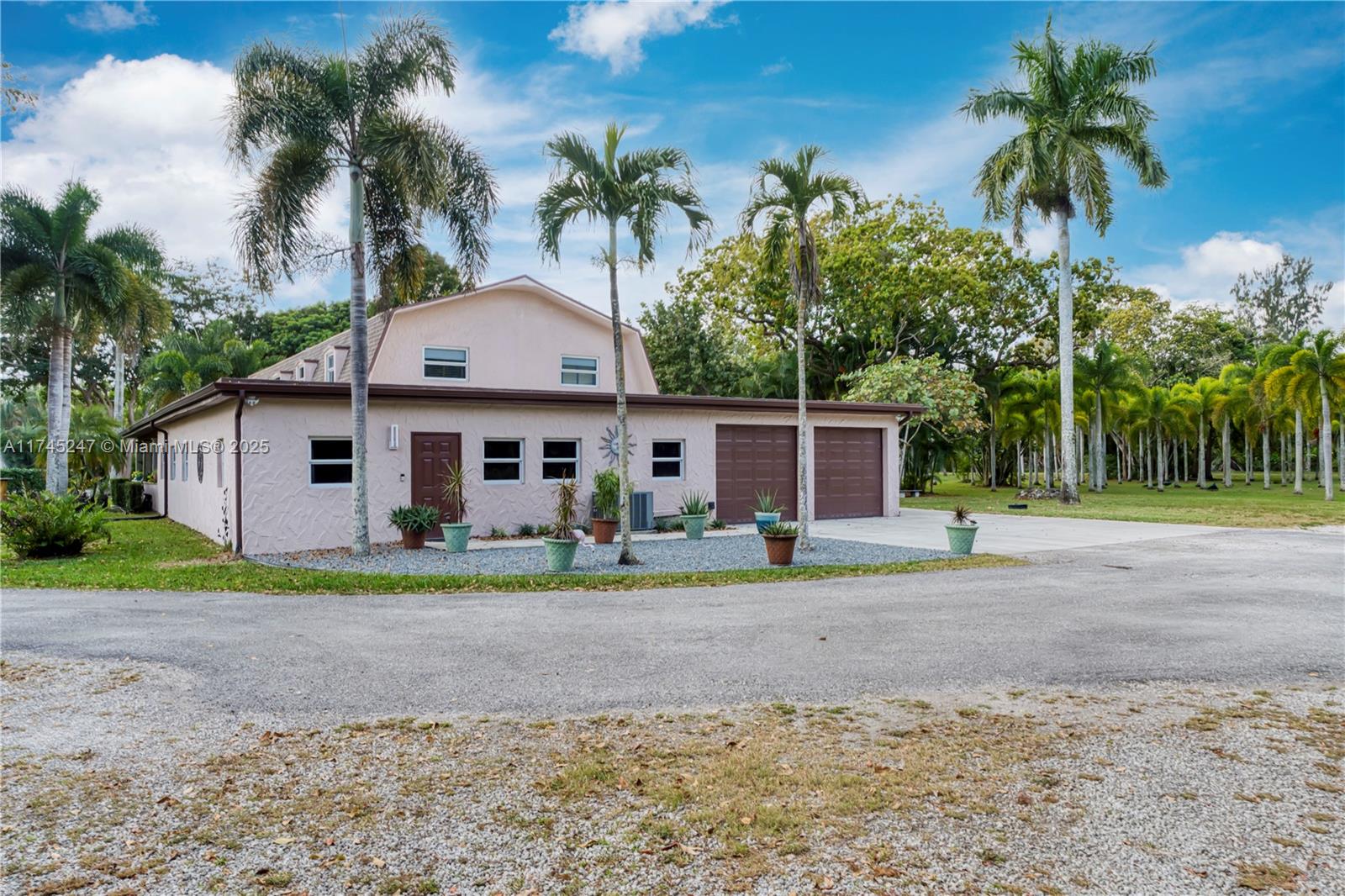 15101 Southwest 27th Street Davie, FL 33331 - Photo 58 of 100 a view of a house with a yard and palm trees