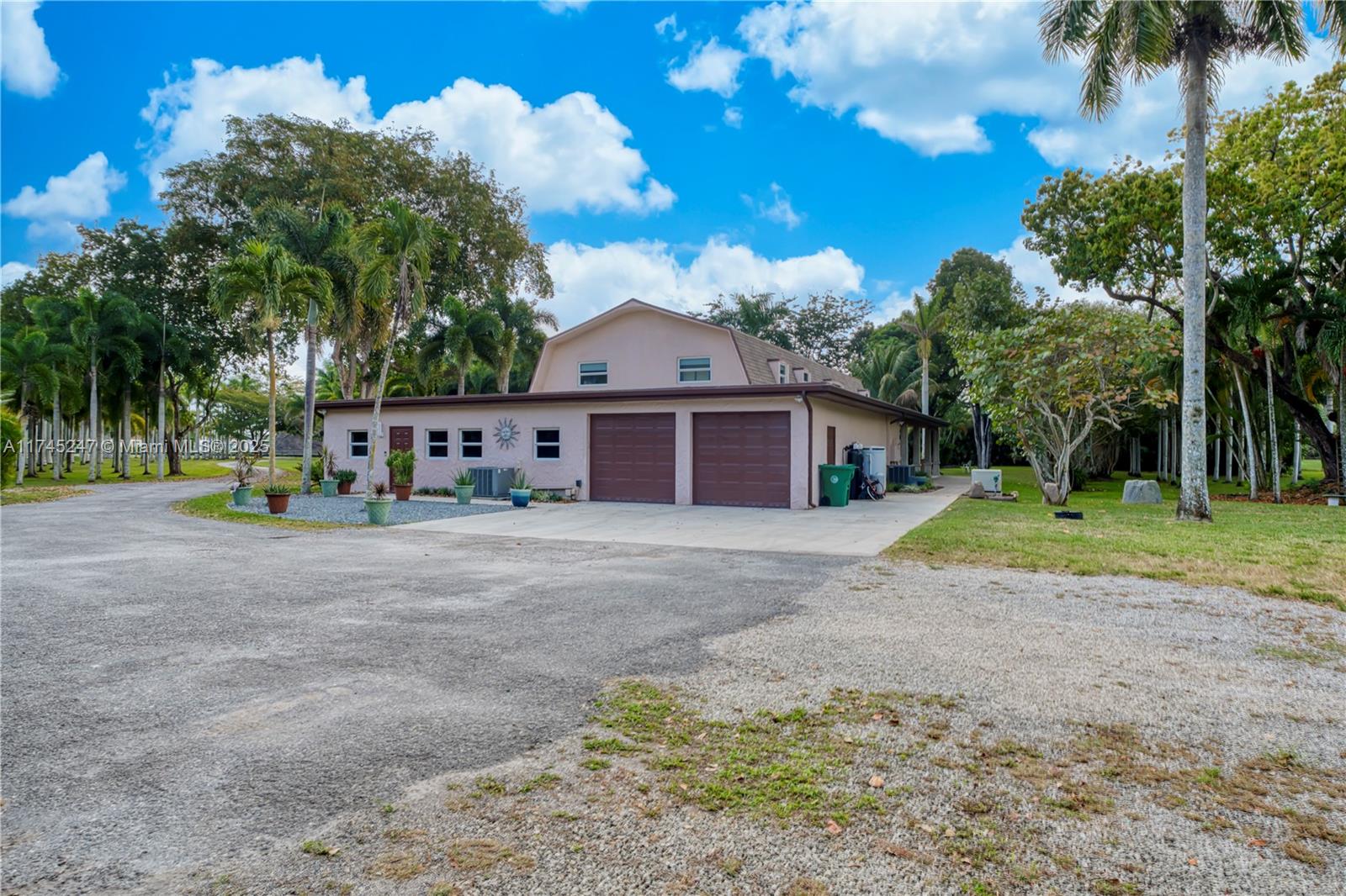 15101 Southwest 27th Street Davie, FL 33331 - Photo 59 of 100 a view of a house with a yard and a large tree