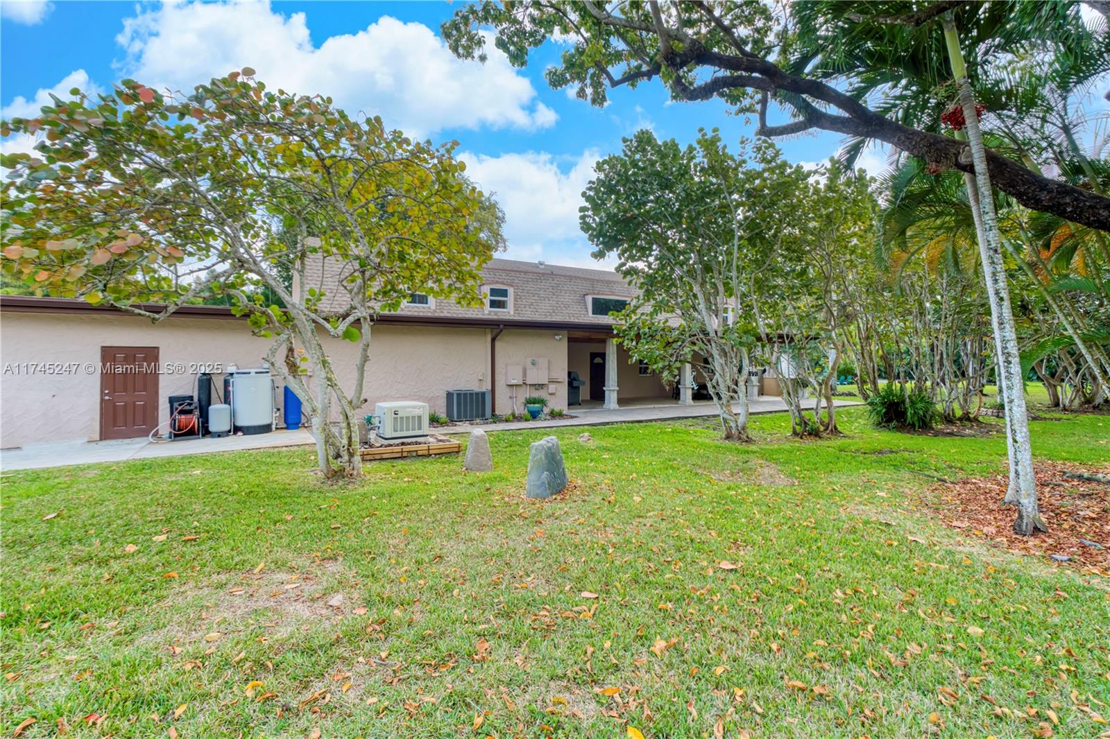 15101 Southwest 27th Street Davie, FL 33331 - Photo 62 of 100 a house view with a sitting space and garden