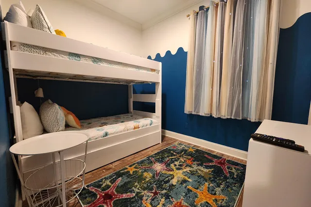 a living room with furniture and a rug