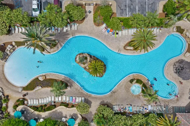 an aerial view of a swimming pool and outdoor space