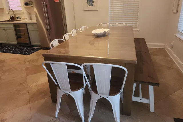 a dining room with furniture and wooden floor