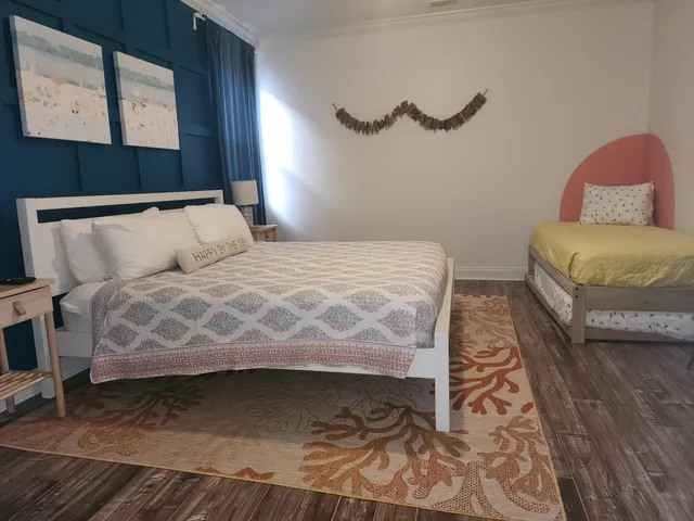 a bedroom with a bed and window