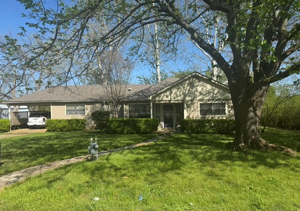 front view of a house with a yard