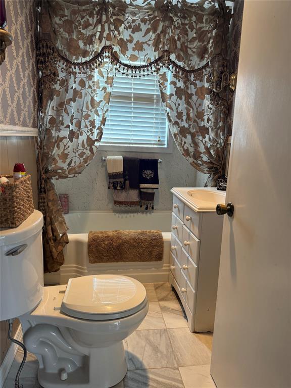 429 South Broadway Street Bells, TX 75414 - Photo 15 of 18 a bathroom with a sink toilet and shower