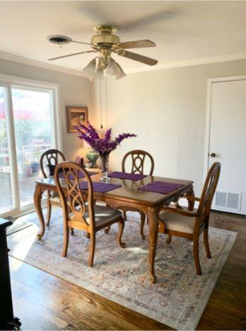 429 South Broadway Street Bells, TX 75414 - Photo 8 of 18 a view of a dining room with furniture window and wooden floor