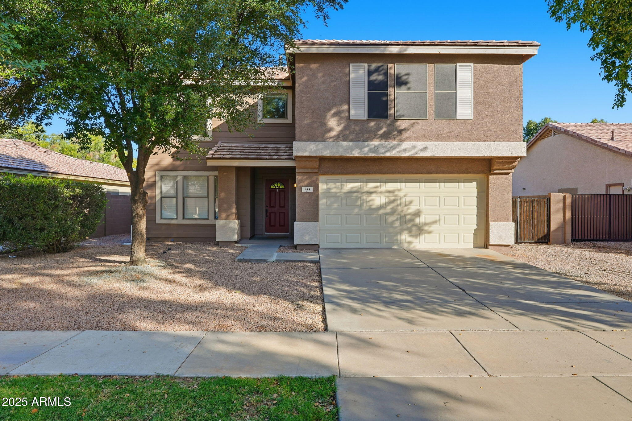 a front view of a house with garage