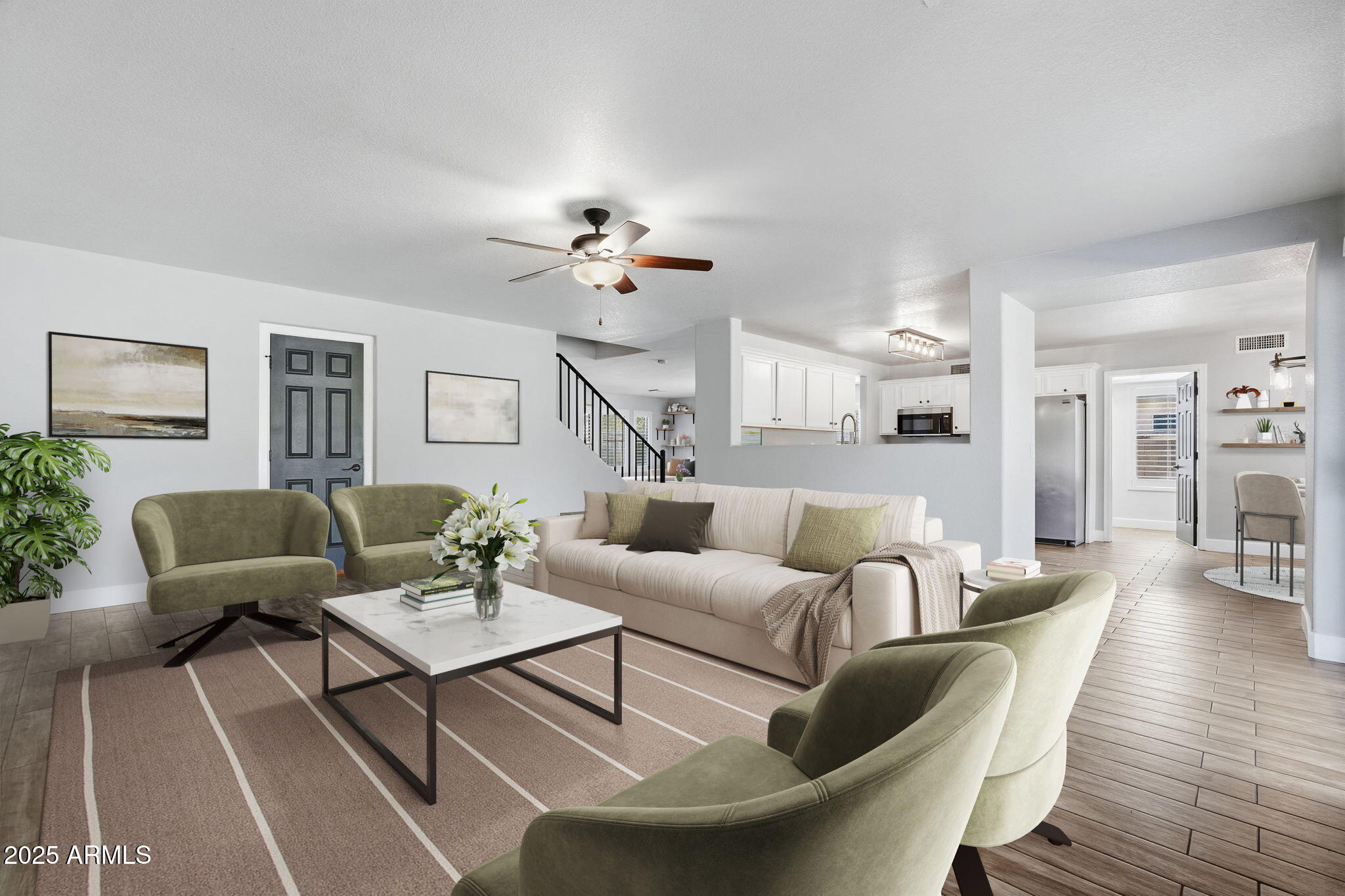 544 West Aviary Way Gilbert, AZ 85233 - Photo 12 of 45 a living room with furniture or kitchen view and a wooden floor