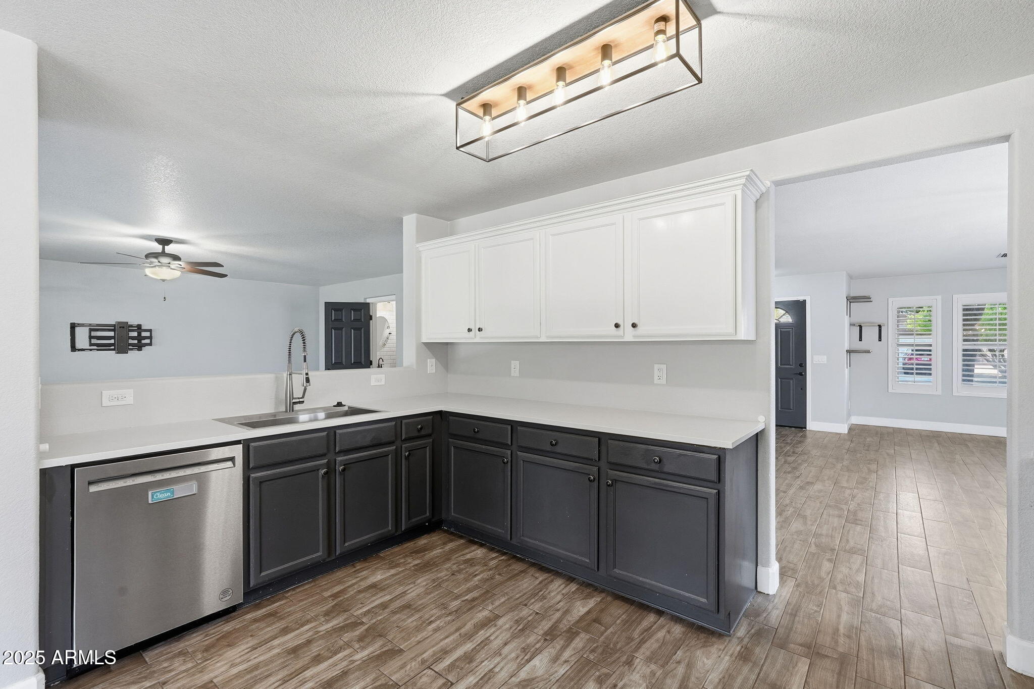 544 West Aviary Way Gilbert, AZ 85233 - Photo 16 of 45 a kitchen with a sink cabinets and wooden floor