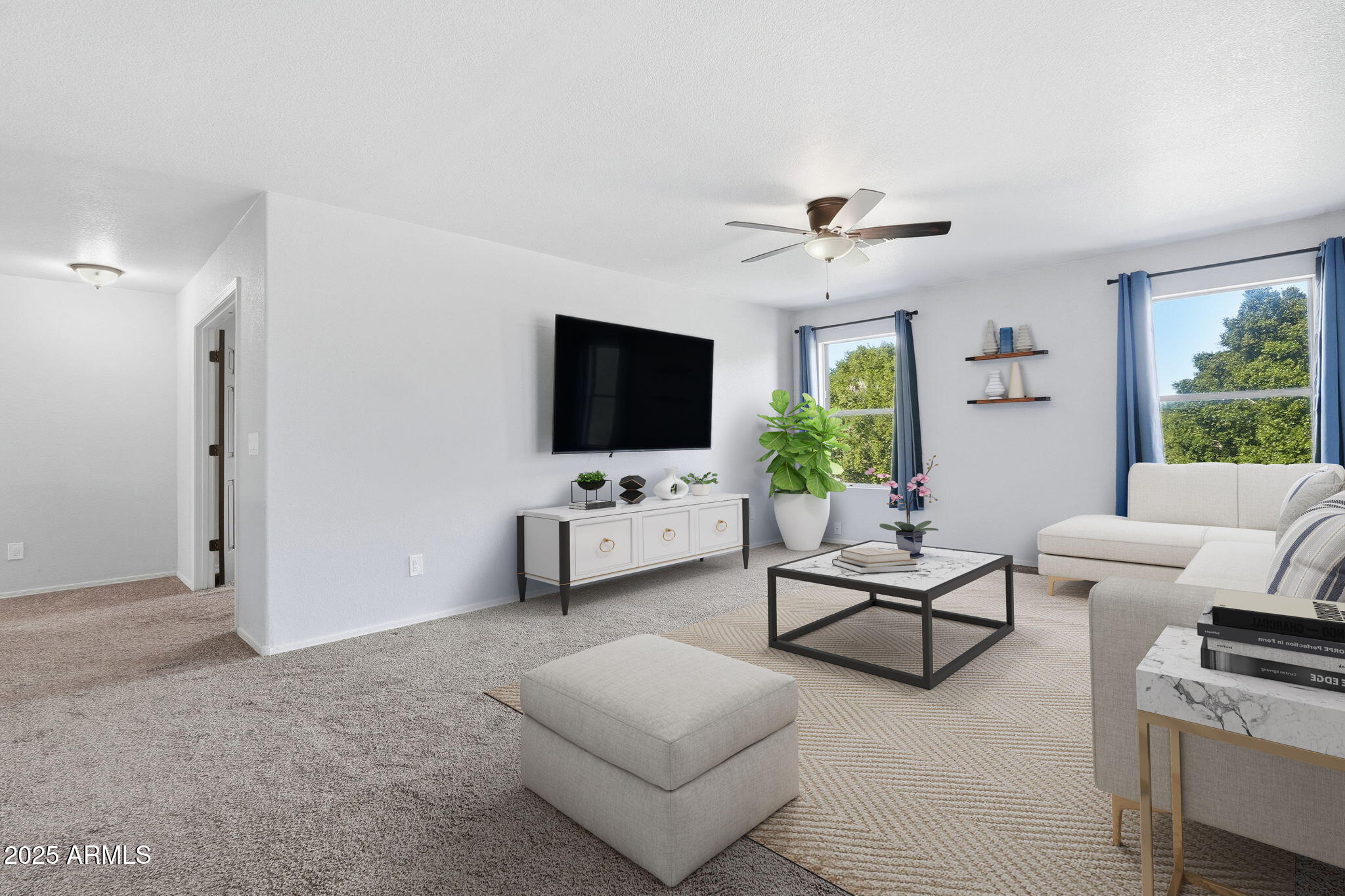 544 West Aviary Way Gilbert, AZ 85233 - Photo 20 of 45 a living room with furniture and a flat screen tv
