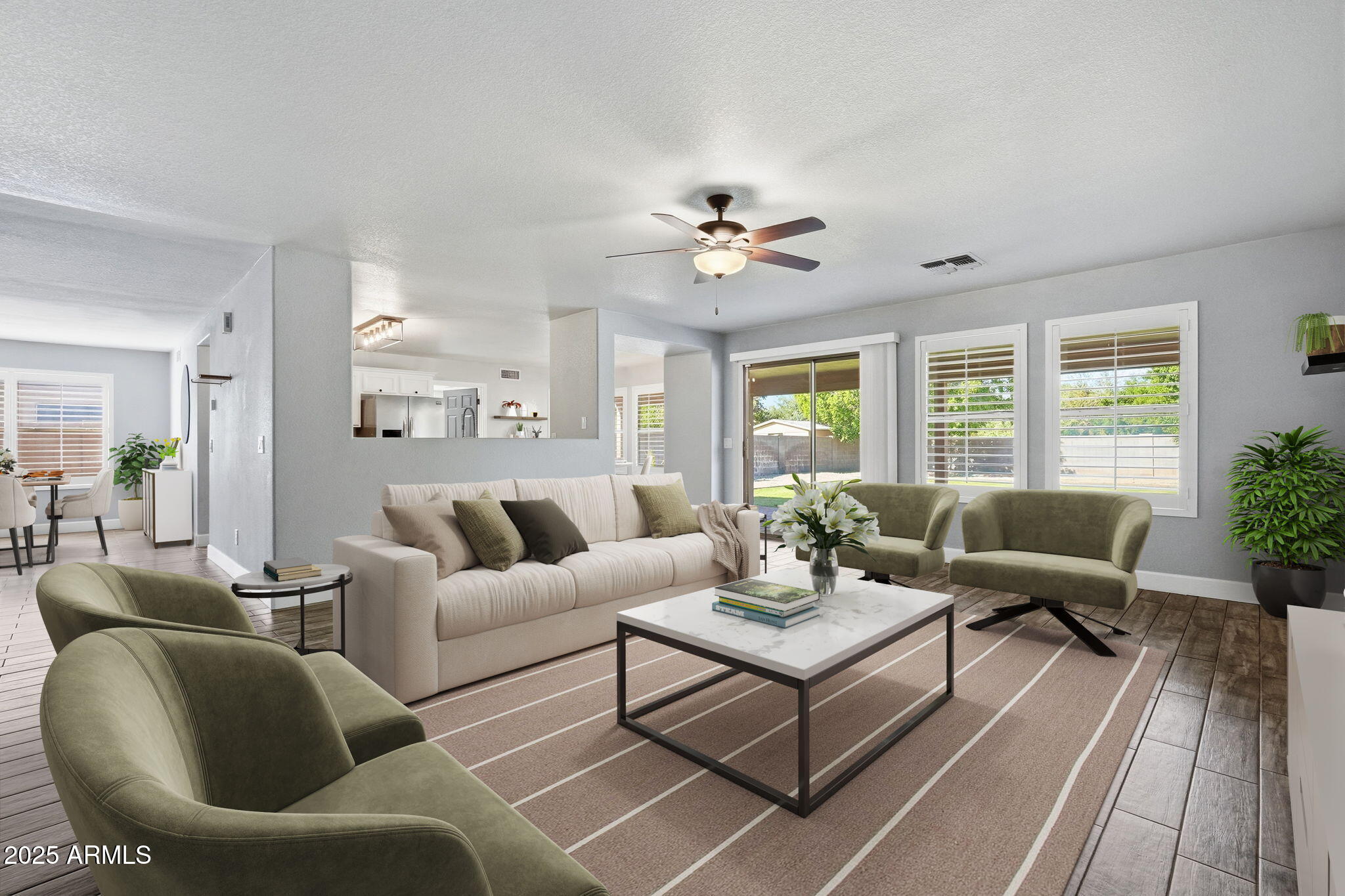 544 West Aviary Way Gilbert, AZ 85233 - Photo 2 of 45 a living room with furniture potted plant and a window