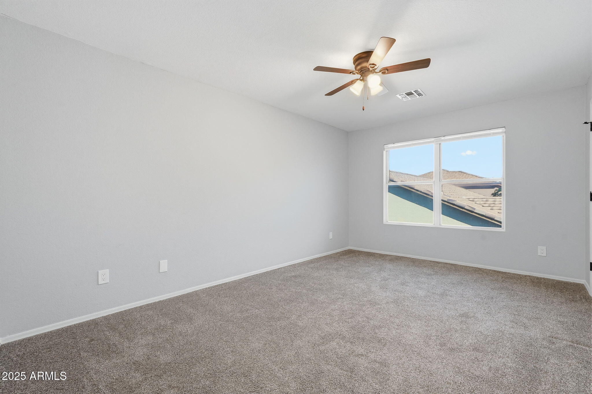 544 West Aviary Way Gilbert, AZ 85233 - Photo 25 of 45 an empty room with window and ceiling fan