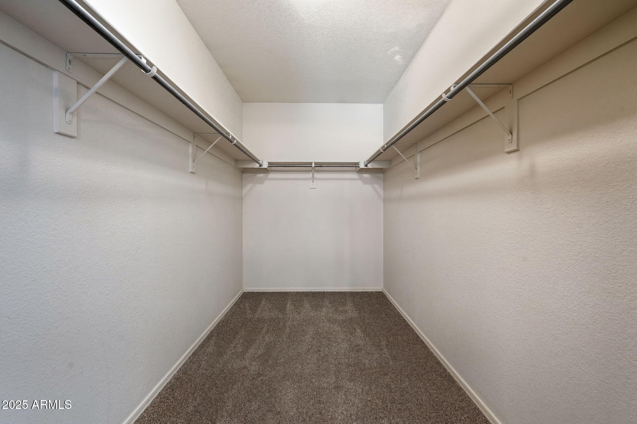 544 West Aviary Way Gilbert, AZ 85233 - Photo 27 of 45 a view of a room with racks on the wall